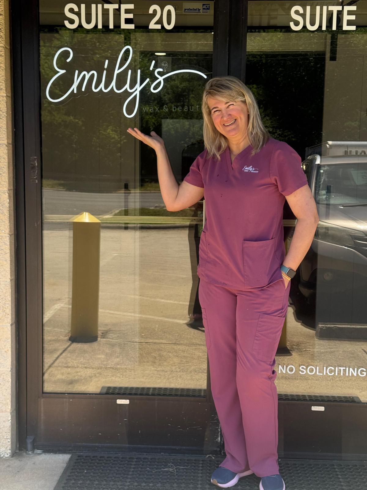 Emily, the owner of Emily's Wax and Beauty, smiling warmly in the studio